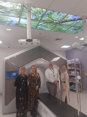 Dom next to Queen's Hospital Halcyon Linac, with Lynsey and Sarah from RTUK and Siobhan Graham, Head of Radiotherapy at Romford 